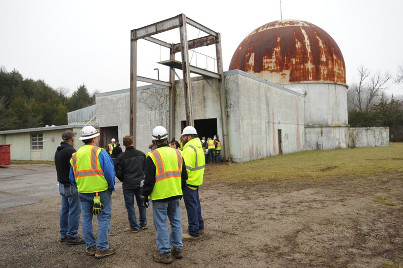 NWA Democrat-Gazette/ANDY SHUPE
A group of visitors and officials from the University of Arkansas and Energy Solutions speak Thursday, Jan. 19, 2017, during a tour of the shuttered SEFOR nuclear facility near Strickler in southern Washington County. Visit nwadg.com/photos to see more photographs from the tour.