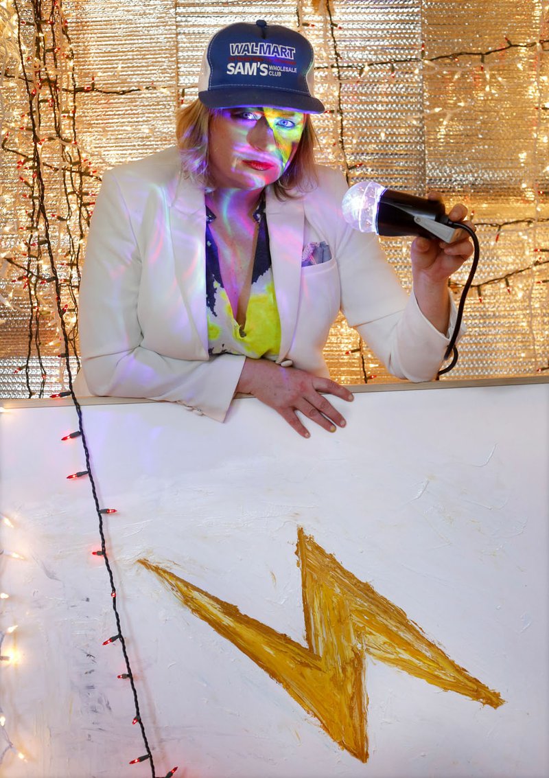 NWA Democrat-Gazette/DAVID GOTTSCHALK Kat Wilson poses in her studio with a piece from her recent series, "Emojis."
