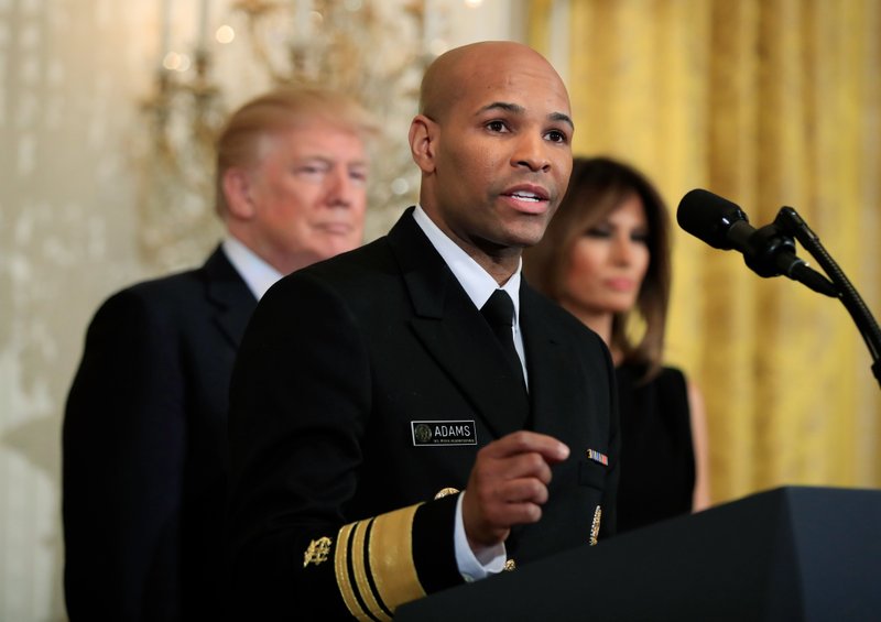 In this Feb. 13, 2018, file photo, Surgeon General Jerome Adams speaks during a National African American History Month reception hosted by President Donald Trump and first lady Melania Trump in the East Room of the White House in Washington. The nation's chief doctor wants more Americans to start carrying the overdose antidote naloxone in an effort to combat the nation's opioid crisis. U.S. Surgeon General Dr. Adams is expected to speak about the public health advisory Thursday, April 5, at the National Rx Drug Abuse & Heroin Summit in Atlanta. 