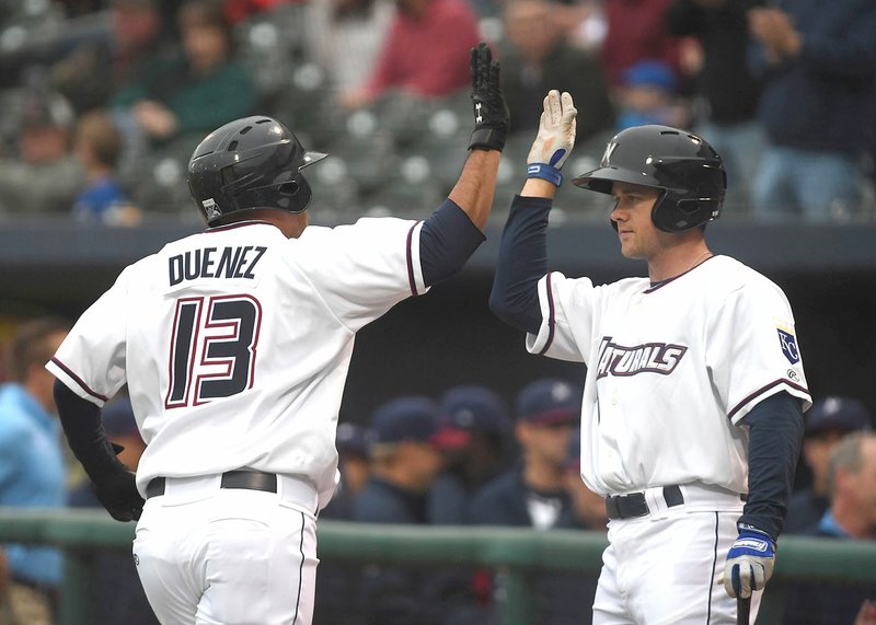 Naturals’ Samir Duenez (left) is congratulated by Donnie Dewees after hitting a first-inning home run Thursday against Corpus Christi at Arvest Ballpark in Springdale.