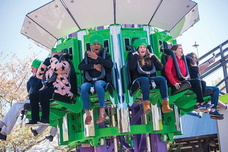 Magic Springs Theme and Water Park general manager Jack Bateman, from left, Tracy Durham, Alfred Warren, Kristen Nicholson, Meaghan Ferneau and Mary Claire Hill react after riding the new ride Brain Drain at Magic Springs in Hot Springs. The park is celebrating the 40th anniversary of its opening with the park’s first new thrill ride in 10 years. 