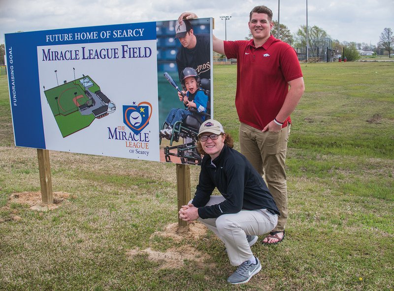 Peyton Wright, kneeling, and Drew Vest, both Searcy High School juniors, are working to raise money for a Miracle League baseball field, which will be built on Higginson Street. The project is part of the students’ Environmental and Spatial Technology class. Wright helped form the Miracle League of Searcy, a 501(c)(3) nonprofit organization, and the first fundraiser, a powder-puff football game, is scheduled for 2 p.m. Saturday at Searcy Lion Stadium. Admission is $5, and donations will be accepted, too.