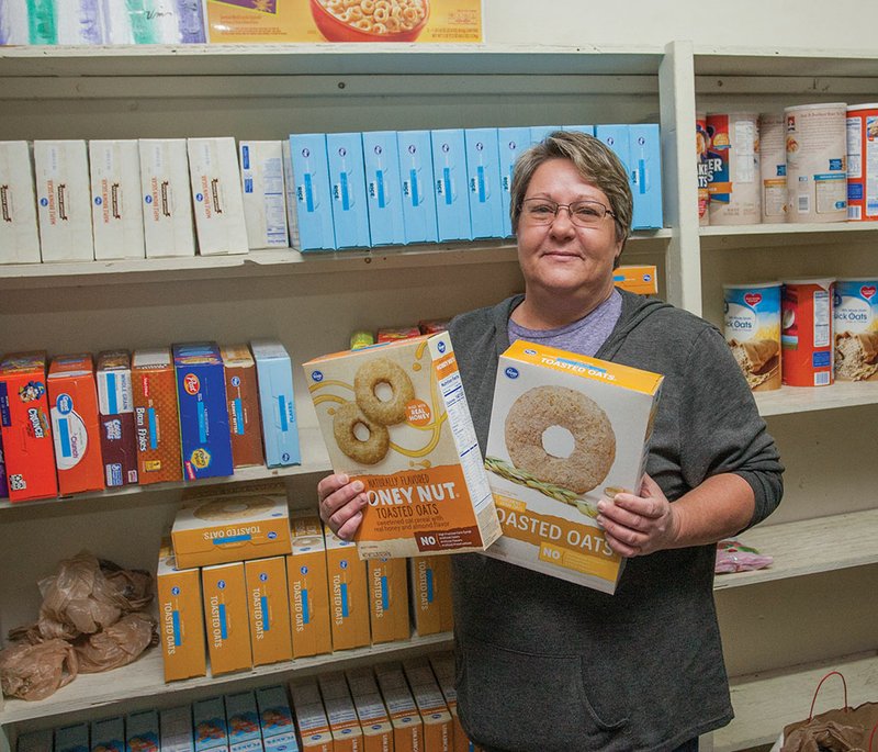 Cindy Lucariello, pantry manager for the Conway County Care Center, 108 W. Broadway in Morrilton, holds boxes of cereal. The pantry will conduct its annual cereal drive from 9 a.m. to 1 p.m. Saturday, and people may drop off donations. Also, a donation box will be displayed at Kroger in Morrilton this week, and donations may be dropped off there on Saturday.