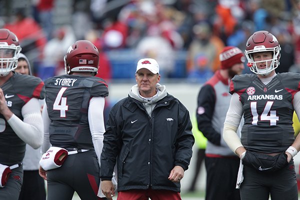 Arkansas coach Chad Morris watches quarterbacks warm up prior to the team's spring game Saturday, April 7, 2018, at War Memorial Stadium in Little Rock. 