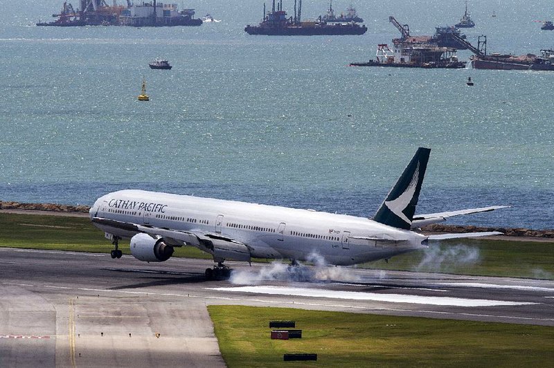 A Boeing Co. 777 aircraft operated by Cathay Pacific Airways lands in Hong Kong in August.  