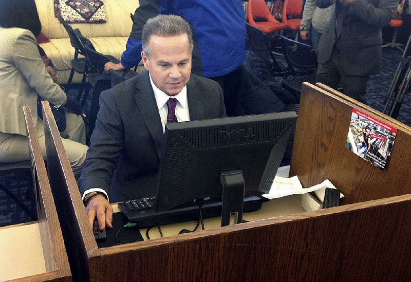 U.S. Rep. David Cicilline completes a census form last month at a library in Providence, R.I.