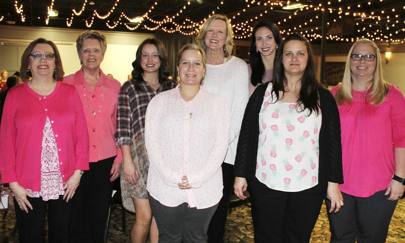 Robbie Brightwell (from left), Kaye Weathers, Anna Laswelll, Kelly Johnson, Elaine Thompson, Samantha Patton, Lora Fox and Kathy Lands represent Parkhill The Clinic for Women at the Komen Promise Circle luncheon March 28 at Mermaids Seafood Restaurant in Fayetteville.