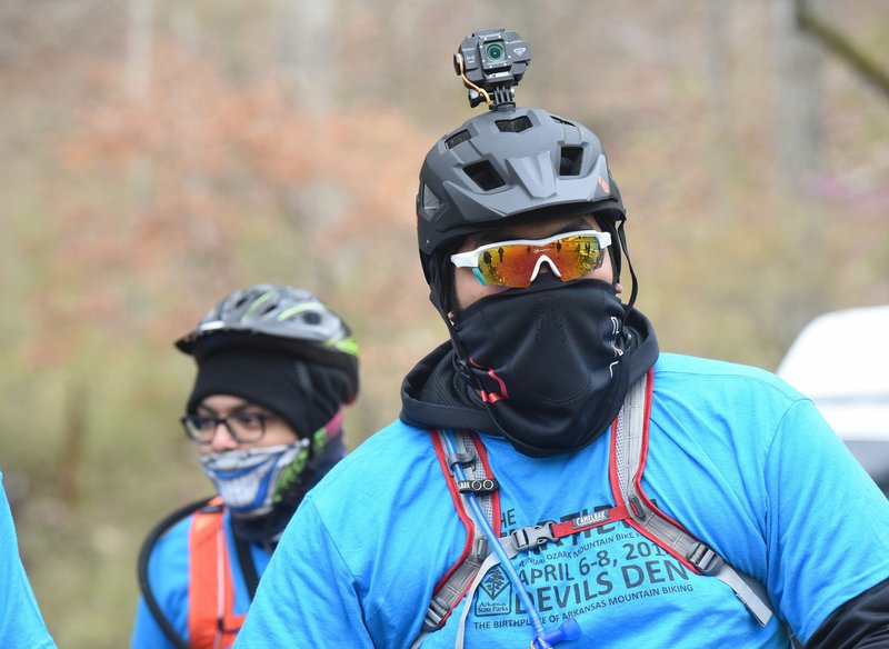 NWA Democrat-Gazette/FLIP PUTTHOFF Alejandro Carrillo (right) and Roberto Avalos, both of Springdale, are dressed for a sub-freezing mountain bike ride Saturday morning at the 30th annual Ozark Mountain Bike Festival at Devil's Den State Park west of Winslow. Saturday's events featured group rides on the Fossil Flats Trail, bicycle games for kids and an evening dinner for riders. Group rides continue today on the park's Fossil Flats Trail in Campground A.