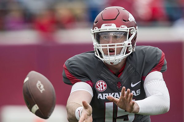 Arkansas quarterback Cole Kelley takes a snap during the Razorbacks' spring game Saturday, April 7, 2018, in Little Rock. 