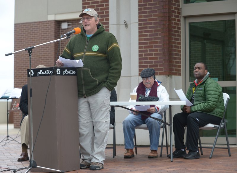 Steve Boss, a geosciences professor at the University of Arkansas and secretary/treasurer-elect of the university campus chapter of the American Federation of State, County and Municipal Employees, Local 965, speaks Saturday during the Living Wage Campaign Rally organized by the University of Arkansas campus chapter of the American Federation of State, County and Municipal Employees, Local 965 in front of the Fayetteville Town Center. The rally was organized to address wages for employees and graduate students at the university. 