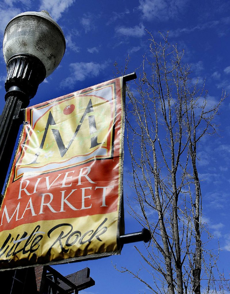 Arkansas Democrat-Gazette/THOMAS METTHE -- 4/8/2018 --
A Red Maple tree soaks up the sun in along President Clinton Ave. in the Little Rock River Market on Sunday, April 8, 2018. The tree is one of 56 trees that the city of Little Rock is reviewing bids to uproot in the River Market and replace them with Bald Cypress trees.