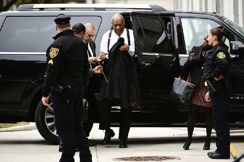 Bill Cosby (center) arrives Monday for his sexual assault trial at the Montgomery County Courthouse in Norristown, Pa.