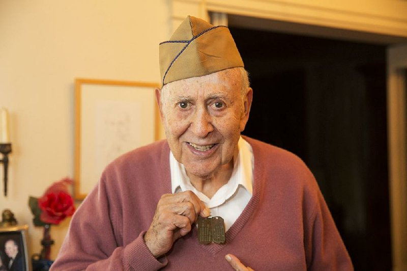 TV legend Carl Reiner (Your Show of Shows,The Dick Van Dyke Show) is one of the veterans featured in the PBS special GI Jews: Jewish Americans in World War II. Here, Reiner, 96, shows off his dog tags (marked H for Hebrew) he wore during the war.
