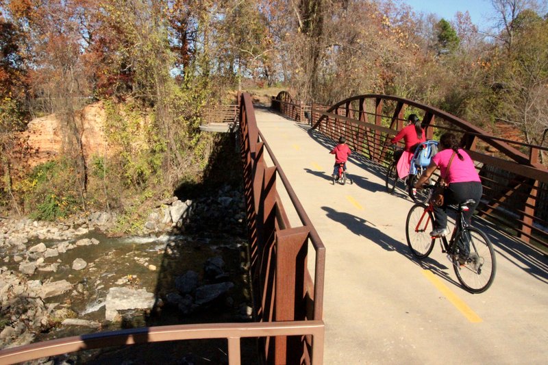 FILE — A family enjoys an outing on the Lake Fayetteville Trail on a cool fall day.