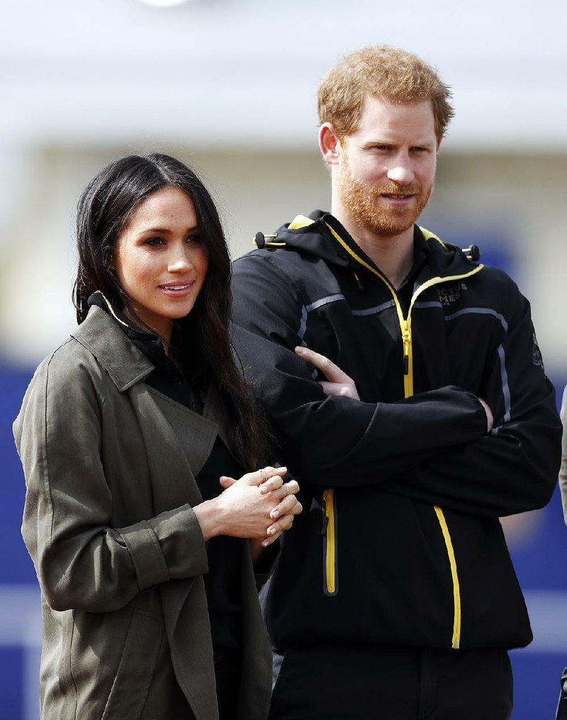 Britain's Prince Harry and his fiancee Meghan Markle attend the UK team trials for the Invictus Games Sydney 2018 at the University of Bath in Bath, England, Friday, April 6, 2018. 