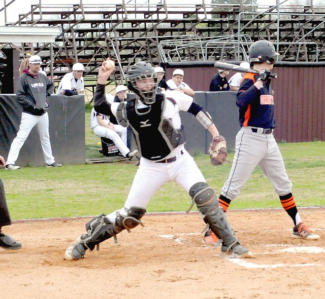 MARK HUMPHREY ENTERPRISE-LEADER Lincoln baseball coach Justin Bounds watches as the Wolves' catcher Josh Jetton attempts to throw out a runner stealing second. Lincoln lost 15-1 to Gravette Thursday.