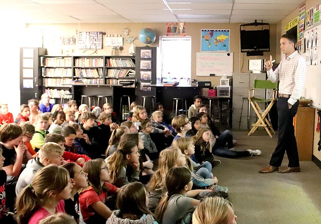 LYNN KUTTER ENTERPRISE-LEADER Colton Flynn, a graduate of Farmington High School, talks to students at Ledbetter Intermediate School in Farmington about living in Ethiopia this year to conduct research and act as an ambassador for the United States. He is a doctoral student at Oklahoma State University.