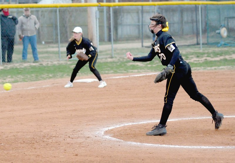 MARK HUMPHREY ENTERPRISE-LEADER Prairie Grove senior Laney Layman delivers a pitch for the Lady Tigers. Layman (59 pitches) alternates with junior Madie Stearman (39 pitches) in the chalked circle. Both threw three innings during a 10-3 loss at Pea Ridge on Monday, March 5.