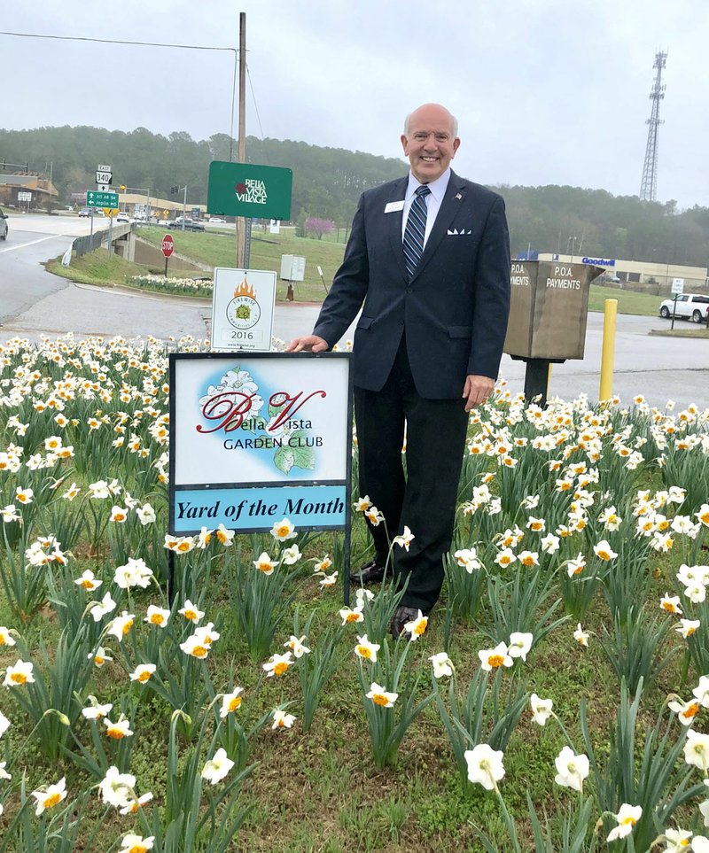 Photo Submitted Pictured is Mayor Peter Christie standing in a beautiful patch of blooming daffodils in front of Bella Vista Fire Department Station 1.