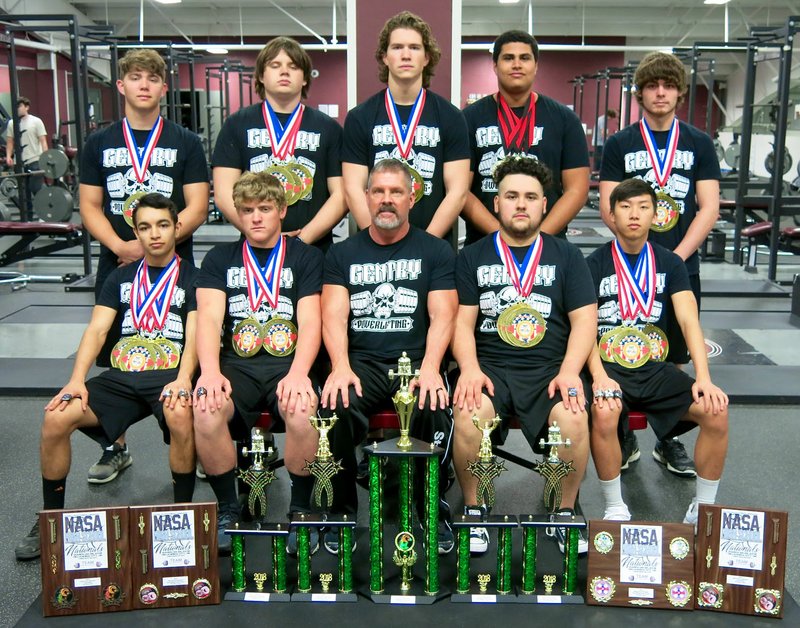 Westside Eagle Observer/RANDY MOLL The Gentry High School power-lifting team participated in the NASA 34th Annual National High School Powerlifting Nationals in Oklahoma City, Okla., on March 24-25, and won its fourth straight national championship. Team members are Lawrence Caro (front, left), Konner Hodges, Coach Sean Seligman, Tomas Gomez, Khang Yang, Tanner Christie (back, left), J.T. Crosby, Mason Clark, Kerlose Ruzek and Gavin Taylor.