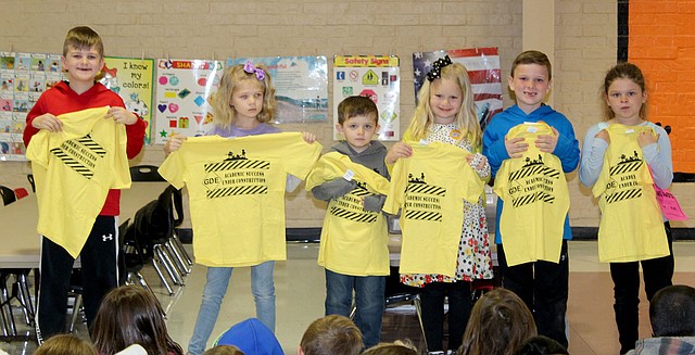 Submitted Photo "Pawsitive" and Wise Student award winners for the month of April at Glenn Duffy Elementary School display the T-shirts they received. Students were honored at the school's Rise and Shine assembly Monday, April 2. PAWS winners for this month are Logan Hall (left), Palmer Pittman, Gage Rutledge, Keeley Brown, Clayton Hand and Elizabeth Nicholas.