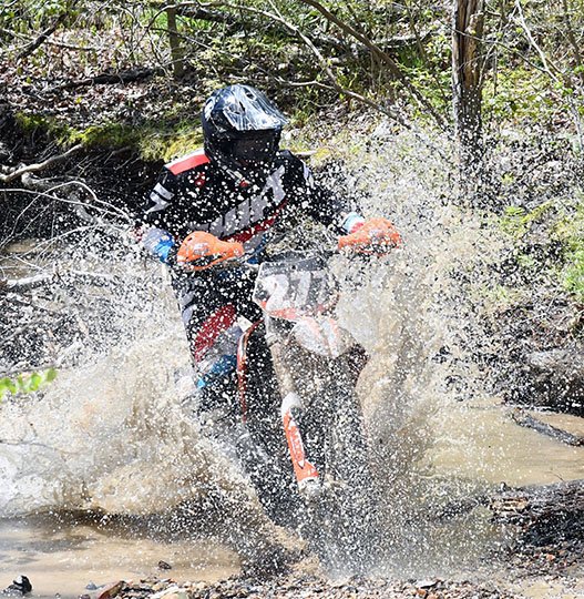 The Sentinel-Record/Grace Brown OFF ROAD: Nicholas Hopkins, of Hot Springs, crosses a creek bed during the Hot Springs ORV 800 race as part of the Arkansas Hare Scramble Championship Series on Sunday at Hot Springs ORV Park. Hopkins finished 48th in the overall long portion of the race.
