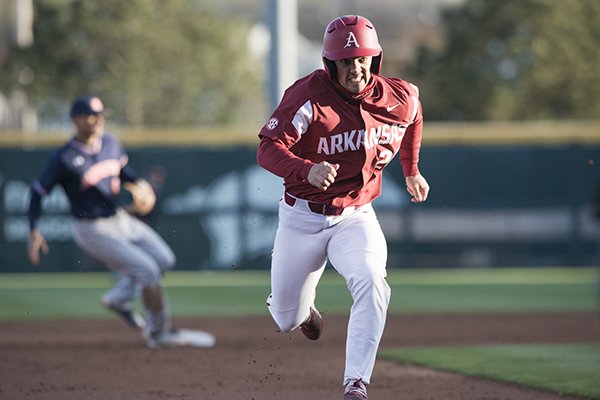 Arkansas outfielder Dominic Fletcher runs to third base during a game against Auburn on Saturday, April 7, 2018, in Fayetteville. 