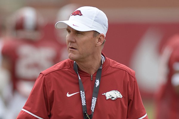 Arkansas coach Chad Morris watches his players Saturday, March 10, 2018, during practice at the university practice field in Fayetteville.