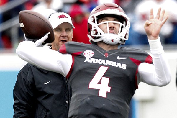 Arkansas coach Chad Morris watches as quarterback Ty Storey throws a pass during warmups prior to the Razorbacks' spring game Saturday, April 7, 2018, in Little Rock. 