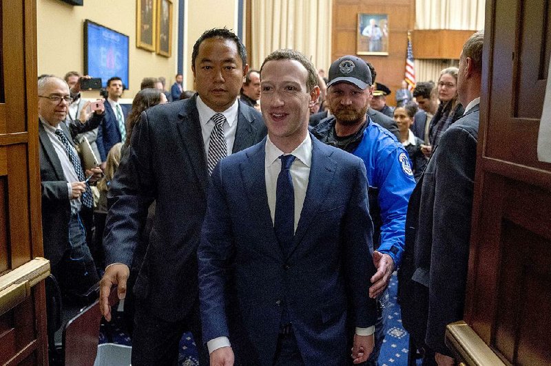 Mark Zuckerberg leaves a House Energy and Commerce Committee hearing Wednesday after five hours of testifying during which he sometimes appeared calm and sometimes frustrated.  