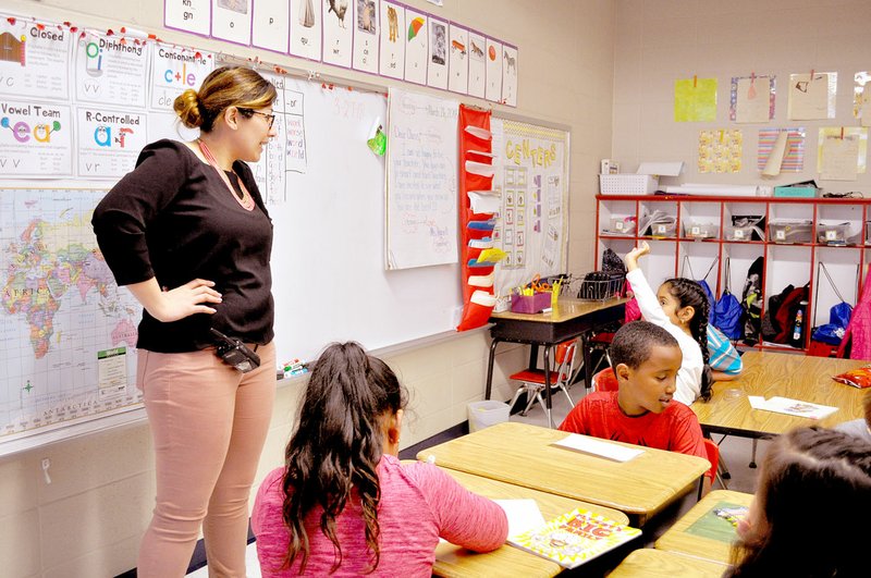 RACHEL DICKERSON/MCDONALD COUNTY PRESS First-grade teacher and native Spanish speaker Mariela Hurtado teaches Spanish to a group of second-graders at Noel Primary School. She teaches Spanish classes to first and second grades at the school.