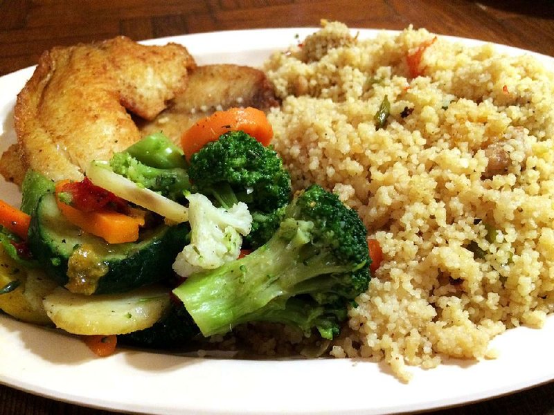 Arkansas Democrat-Gazette/HELAINE R. WILLIAMS

The six main dishes at Alexander's Kontiki African Restaurant include Couscous & Chicken or Fish, livened with vegetables.