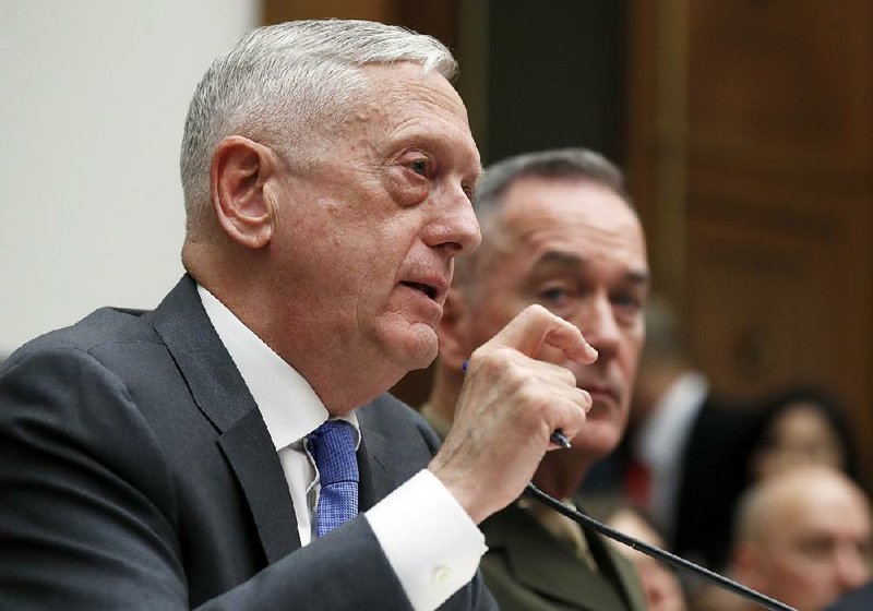 Defense Secretary James Mattis (left) testifies Thursday at a hearing of the Armed Services Committee on Capitol Hill. He is joined by Joint Chiefs Chairman Gen. Joseph Dunford.