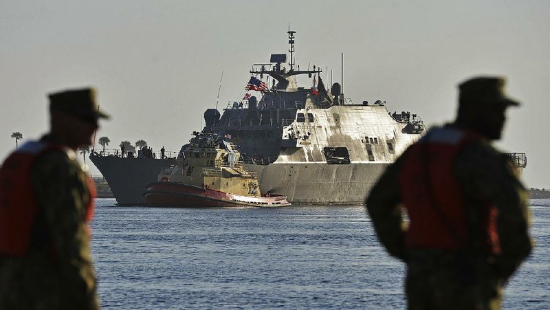 The USS Little Rock arrives at its Mayport Naval Station homeport for the first time since it was commissioned in Buffalo, N.Y., Thursday, April 12, 2018, in Jacksonville, Fla. The ship was stuck in the ice for three months in Montreal. (Will Dickey/The Florida Times-Union via AP)