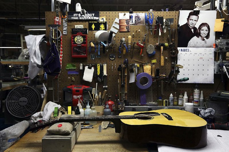 A C.F. Martin and Co. guitar is shown at the company’s factory in Nazareth, Pa. CEO Chris Martin said his company’s transactions are being stalled by paperwork on the import and export of rosewood.  