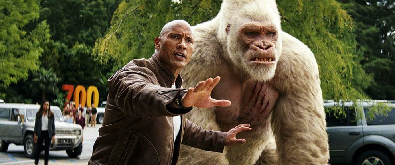 Primatologist Davis Okoye (Dwayne Johnson) and his best friend, the silverback gorilla George (played in motion-capture by Jason Liles) in the video game-derived action movie Rampage. 