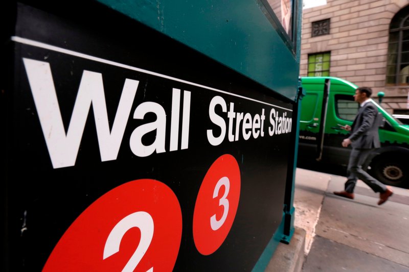 This April 5, 2018, photo shows a sign for a Wall Street subway station in New York. (AP Photo/Richard Drew)