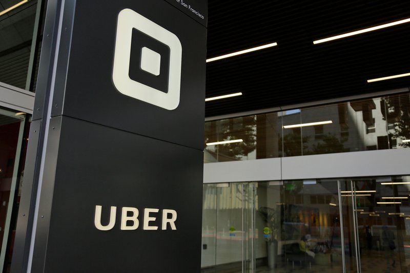 FILE - This June 21, 2017, file photo shows the building that houses the headquarters of Uber, in San Francisco. Uber will start doing annual criminal background checks on U.S. drivers and hire a company that constantly monitors criminal arrests as it tries to do a better job of keeping riders safe, the company announced Thursday, April 12, 2018. (AP Photo/Eric Risberg, File)