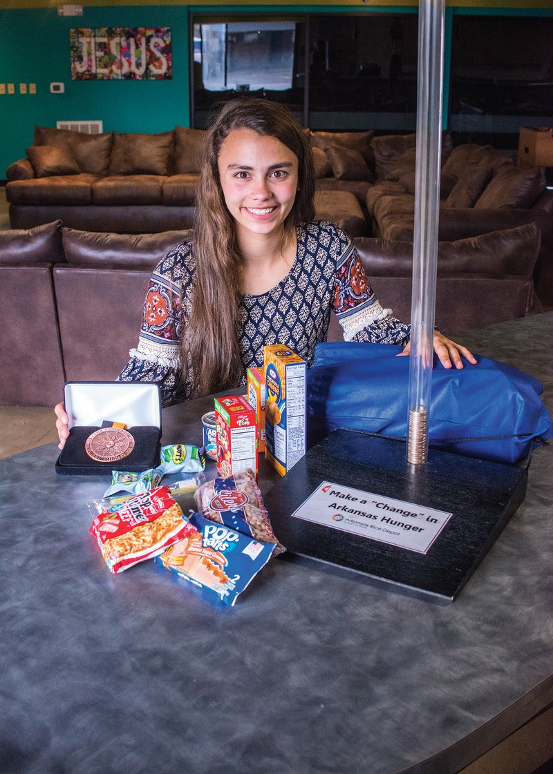 Jameson Archer, 14, has been recognized as a Distinguished Finalist in the Prudential Spirit of Community Awards program for her initiative to fight childhood hunger. She started a quarter drive to raise money for the Sheridan School District’s food backpack program. Jameson’s father, Joe Archer, built the collection boxes, which are 27 inches tall, using clear plastic piping attached to a base.