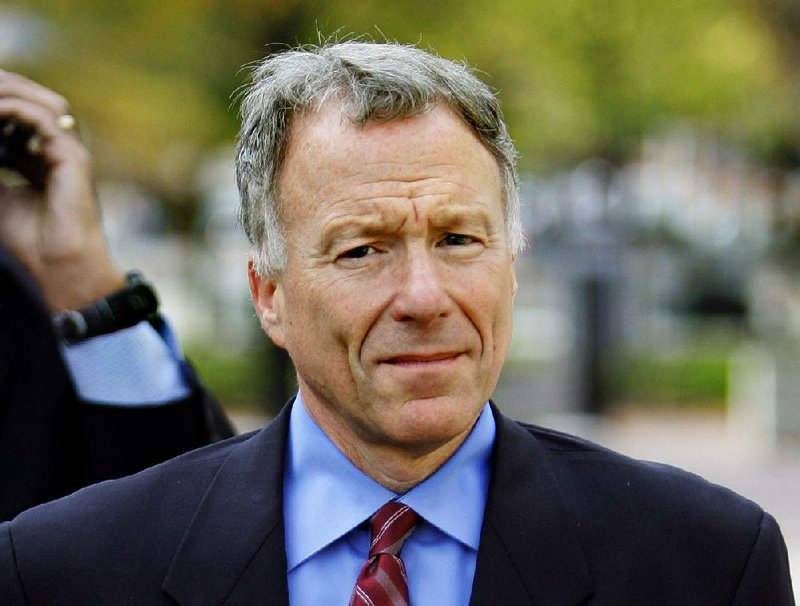 In this Nov. 16, 2005 file photo, I. Lewis "Scooter" Libby, Vice President Dick Cheney's former chief of staff, walks to the U.S. District Court in Washington.  