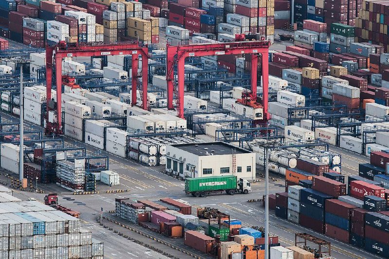 The expansive Yangshan port in Shanghai is pictured in March. China’s exports fell 2.7 percent in March from a year earlier to $174.1 billion, and its previous global trade surplus swung to a $5 billion deﬁcit.

