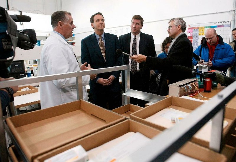 Canada Drugs officials conduct a tour of the company in Winnipeg in 2003. U.S. prosecutors said the online pharmacy’s business model is based on illegally importing unapproved and misbranded drugs.
