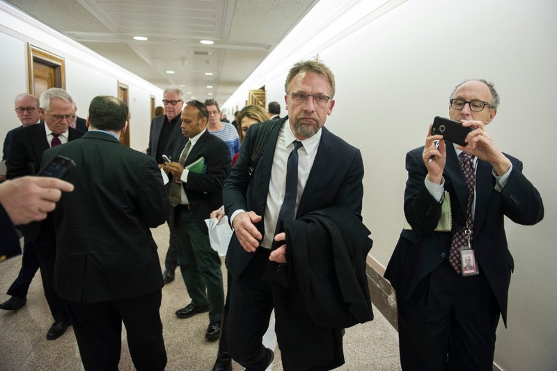 FILE -- In this Jan. 10, 2017 file photo, Backpage.com CEO Carl Ferrer leaves the Senate Homeland Security and Governmental Affairs subcommittee hearing on Capitol Hill in Washington. Ferrer will serve no more than five years in state prison under a plea agreement announced Thursday, April 12, 2018. (AP Photo/Cliff Owen, file)