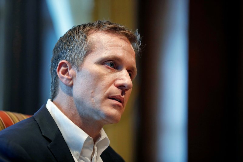 FILE - In this Jan. 20, 2018, file photo, Missouri Gov. Eric Greitens listens to a question during an interview in his office at the Missouri Capitol in Jefferson City, Mo., where he discussed having an extramarital affair in 2015 before taking office. His political future faces a big test Wednesday, April 11 when a special legislative committee issues an investigative report related to the affair. (AP Photo/Jeff Roberson, File)