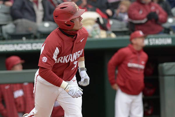 Arkansas second baseman Carson Shaddy follows through with a solo home run Saturday, April 14, 2018, during the second inning against South Carolina at Baum Stadium.