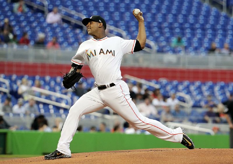 A sea of empty seats are seen behind Miami Marlins relief pitcher Jarlin Garcia during Wednesday’s game against the New York Mets in Miami. Marlins CEO Derek Jeter said the organization will accurately report attendance ﬁgures after dubious counts in past years.