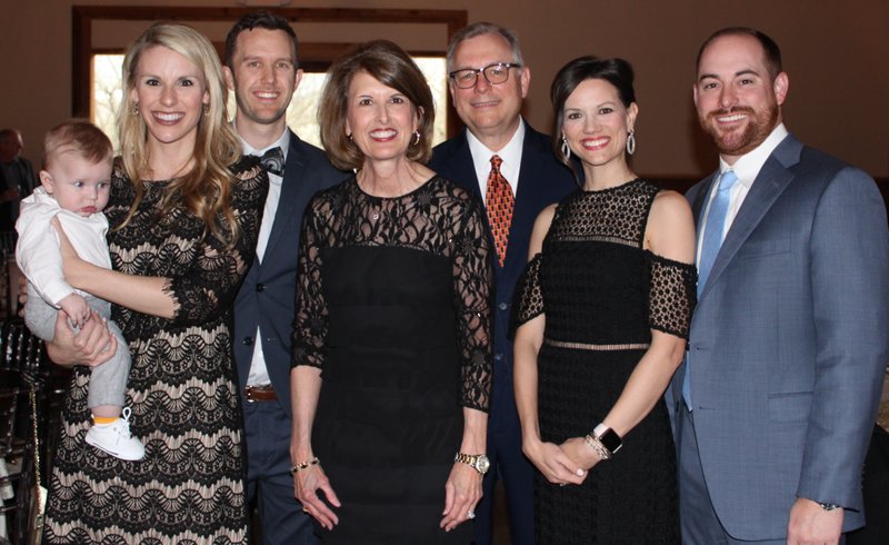 NWA Democrat-Gazette/CARIN SCHOPPMEYER Luke Kelly (from left), Michelle and Chase Kelly, Karen and Dr. Kevin Pope, MS Hope Award honoree, and Allison and Scott Pope gather at A Vintage Affair on April 6 at Sassafras Springs Vineyard and Winery in Springdale.