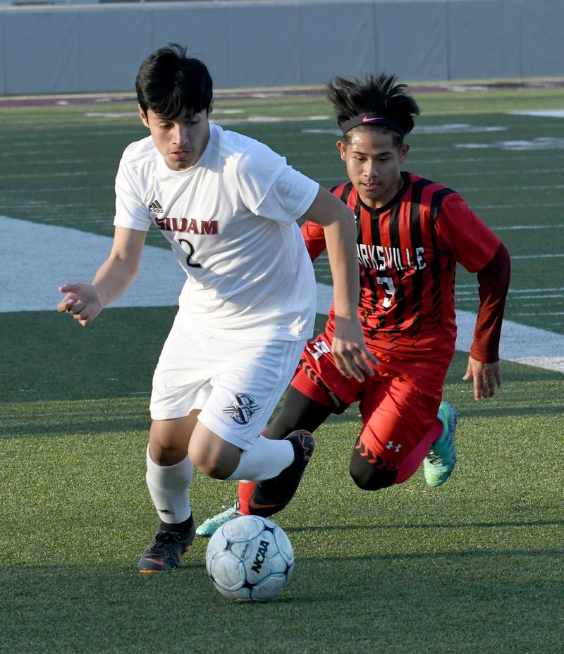 Bud Sullins/Special to Siloam Sunday Siloam Springs freshman Franklin Cortez dribbles ahead of Clarksville's Friday Aye during Tuesday's boys soccer match at Panther Stadium. Siloam Springs defeated Clarksville 4-0.