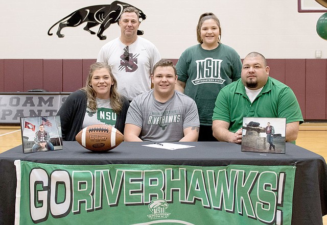 Bud Sullins/Special to Siloam Sunday Siloam Springs senior football player Jackson Knight signed a letter of intent Wednesday to play football as a preferred walk-on at Northeastern State University in Tahlequah, Okla. Pictured are, front from left, mother Beth Knight, Jackson Knight, father Frank Knight; back, former Siloam Springs head football coach Bryan Ross and sister Whitlee Knight.