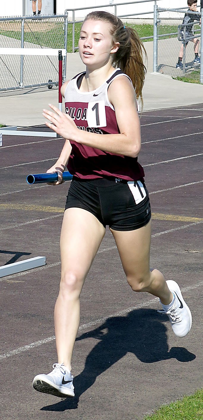 Randy Moll/Westside Eagle Observer Siloam Springs track athlete Emma Hulbert runs a leg in a relay during the Gentry Pioneers Relays on Thursday.